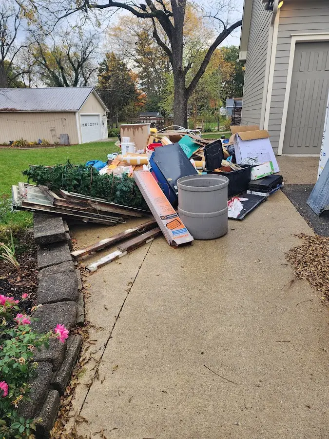 Dumpster being loaded with debris for 3 Yard Dumpster Rental in Jasmine Estates